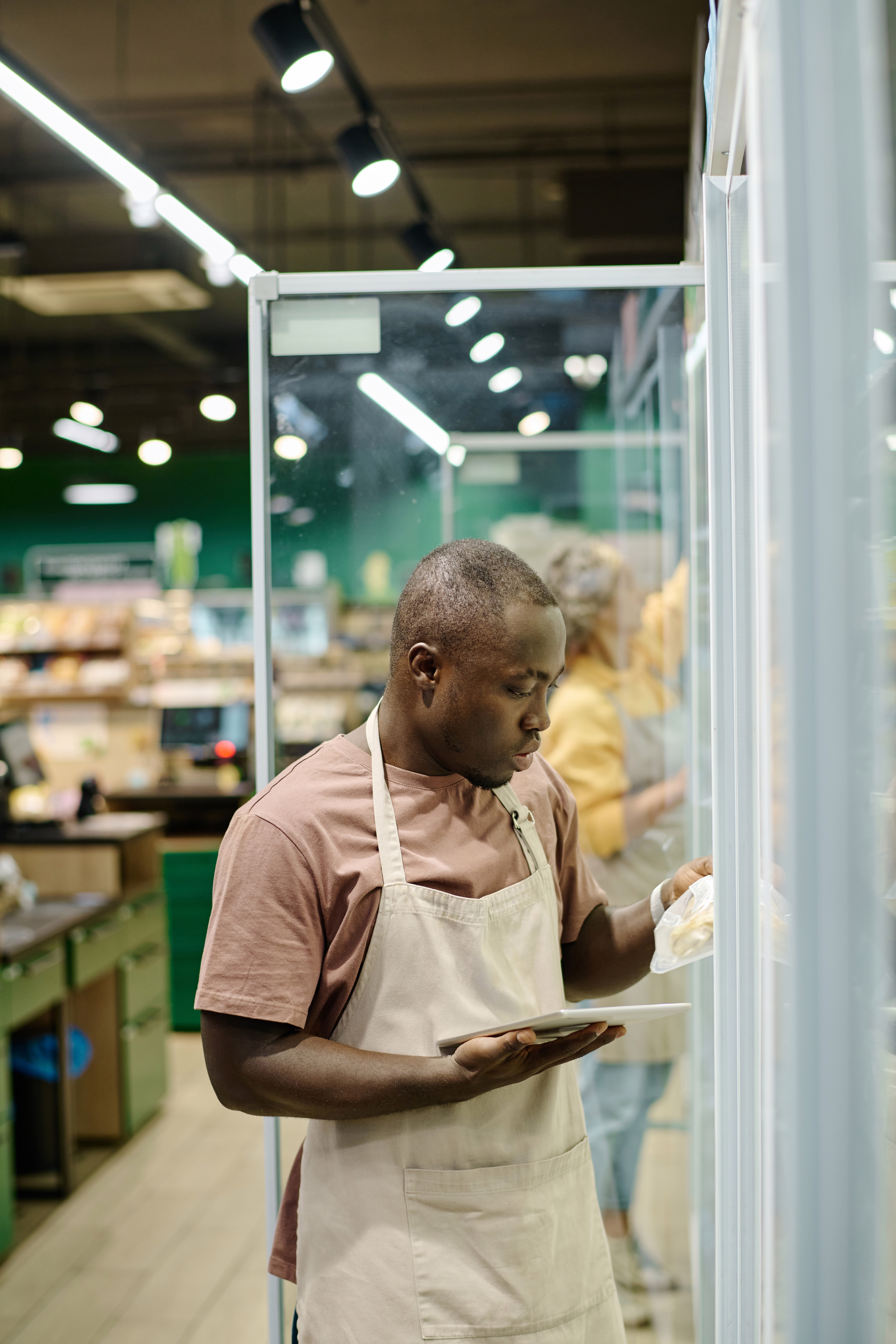 Interior of a neighborhood grocery market, representing the food retail accounts Greenwood General helps brokers place