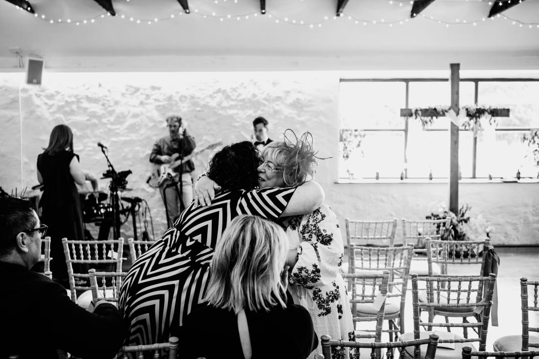 Musicians play as guests take their seats in the barn