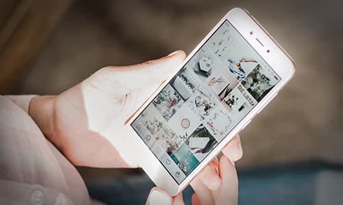 Contact us to help take climate change action. Image shows a woman's hands holding smartphone