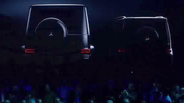 two luxury suvs displayed against a dark background two luxury suvs displayed against a dark background