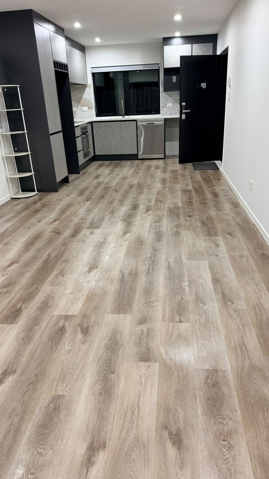 Open-plan kitchen and living area, floors mopped