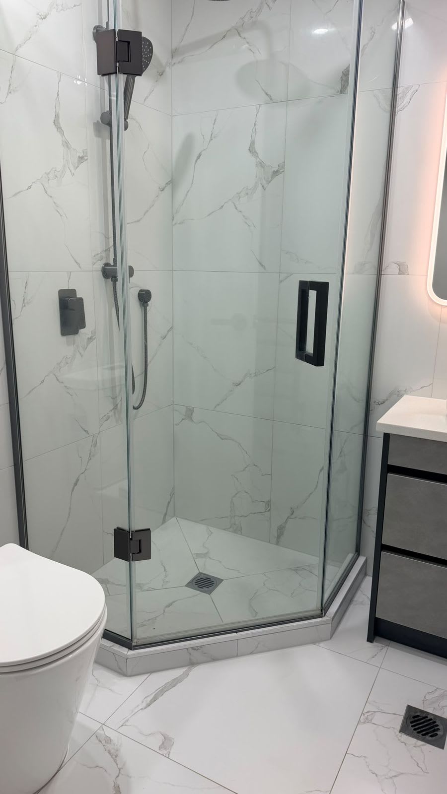 Marble-look corner shower