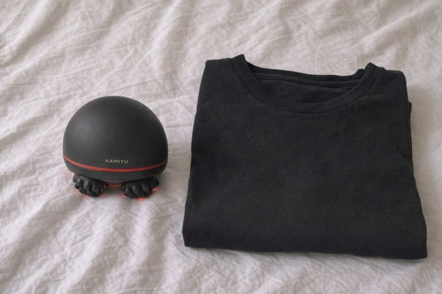 The black dome beside a folded black t-shirt