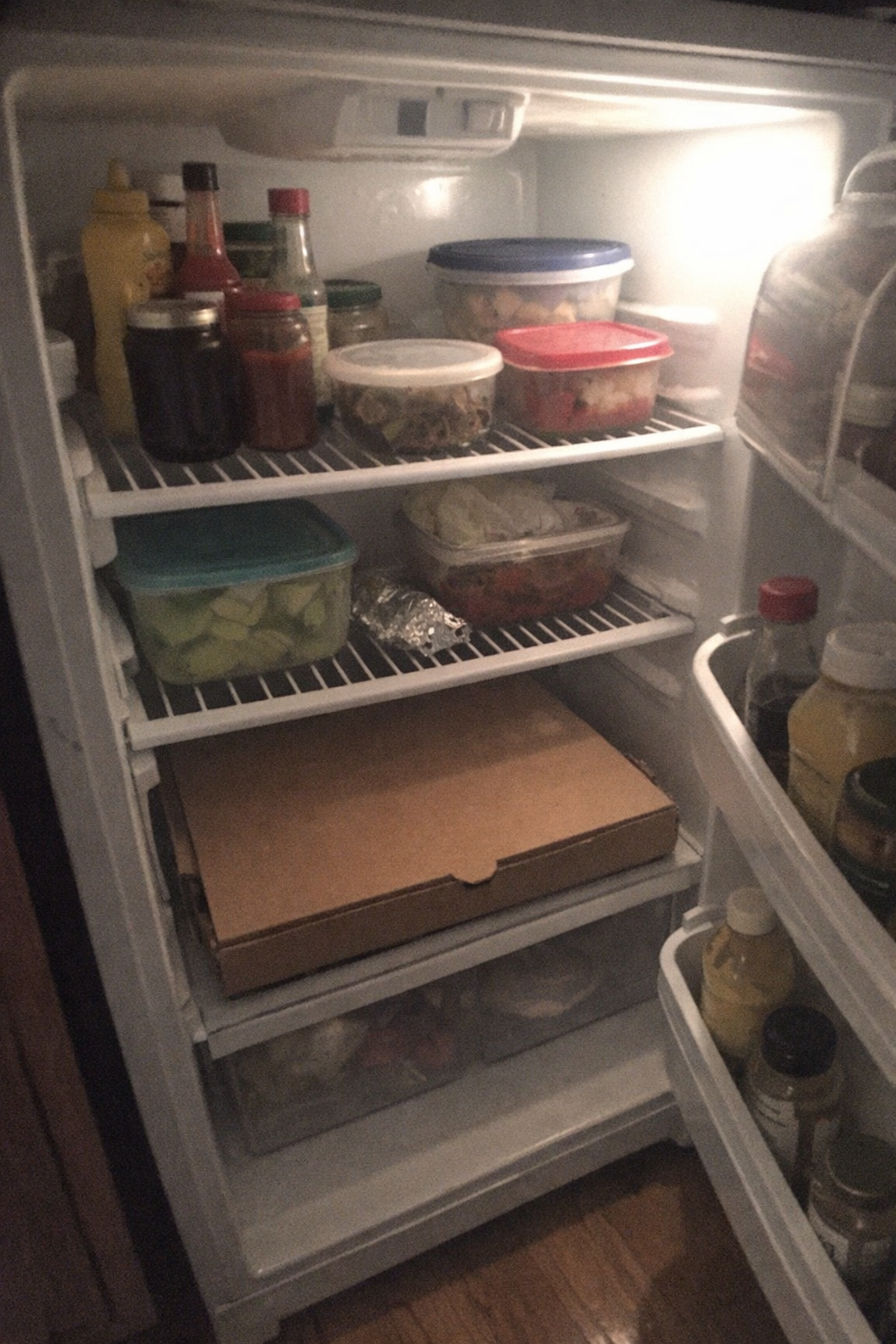 An open fridge at night