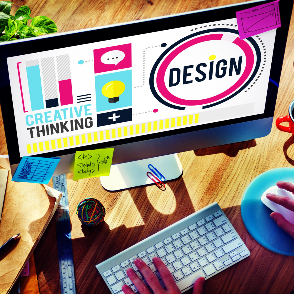 iMac screen with graphic design assets