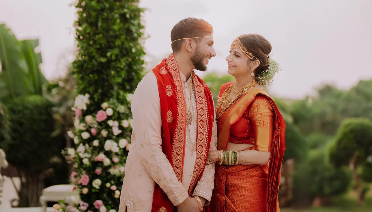 Traditional Indian wedding stage decoration with bride and groom