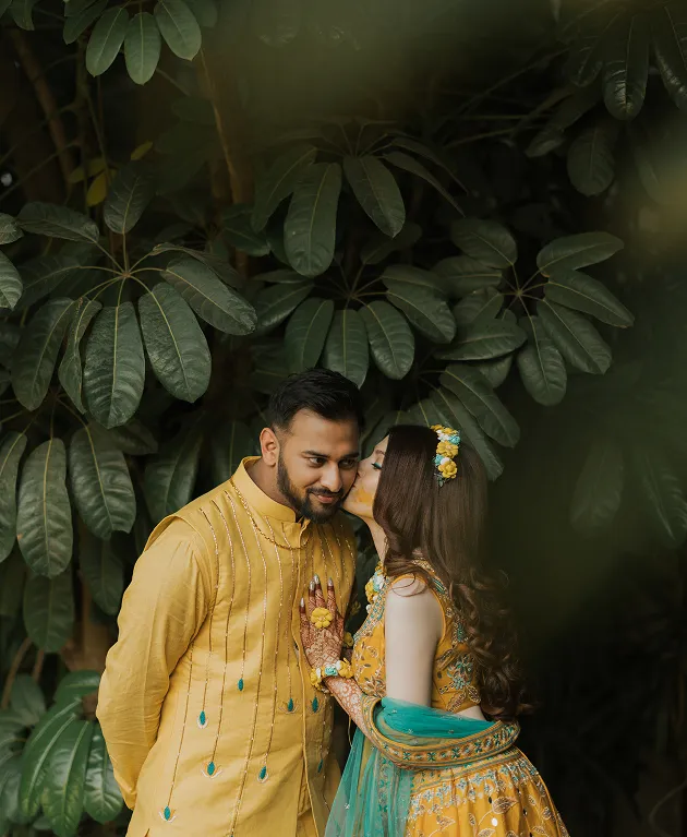Romantic couple portrait during haldi celebration