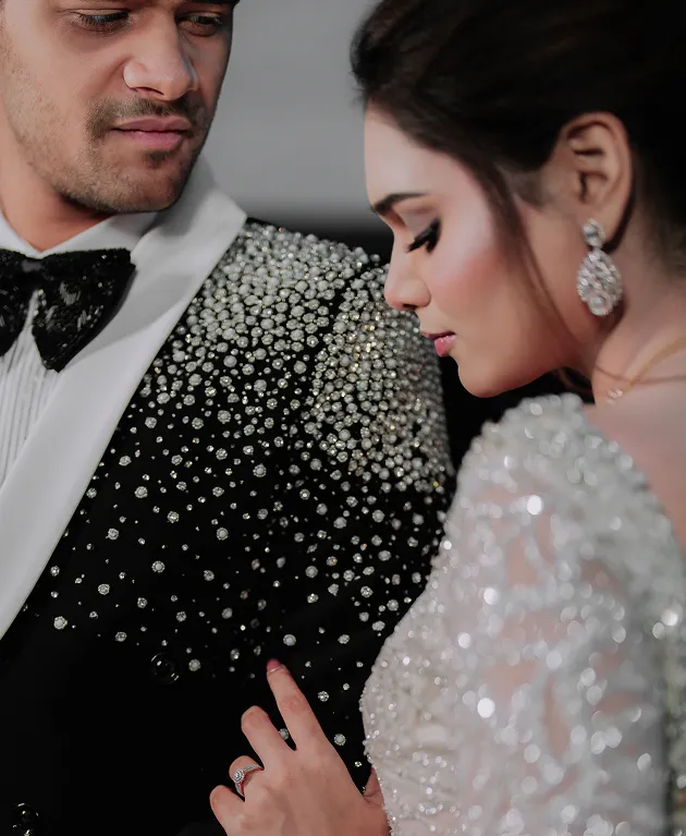 Stylish closeup portrait of couple during reception celebration