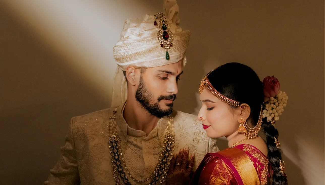 Traditional Indian wedding stage decoration with bride and groom