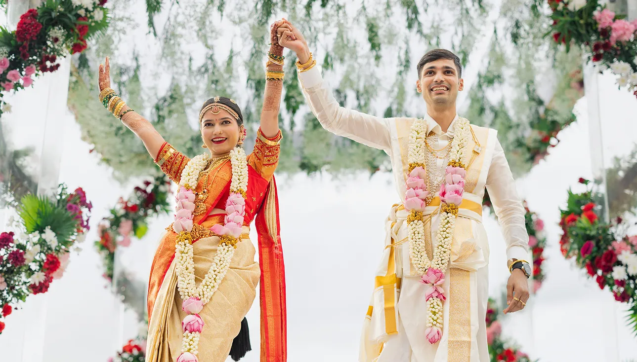 Traditional Indian wedding stage decoration with bride and groom
