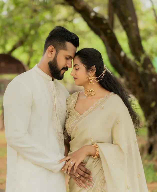 Outdoor pre wedding photoshoot of couple sitting together by the lake