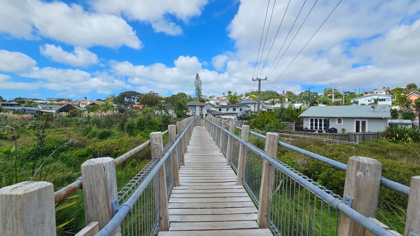 Small wooden bridge leading to Merwood Ln playground