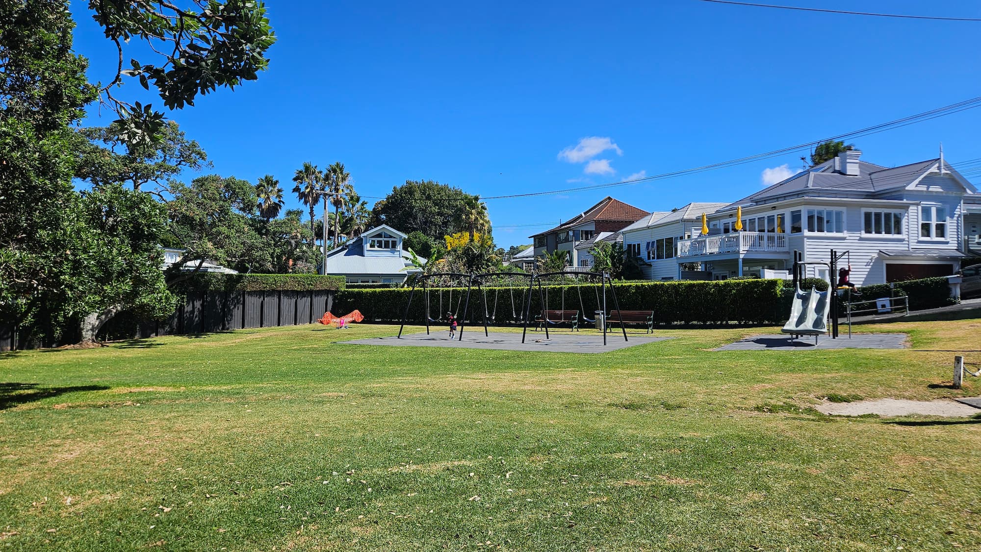Cheltenham Beach Playground slide with scenic beach view