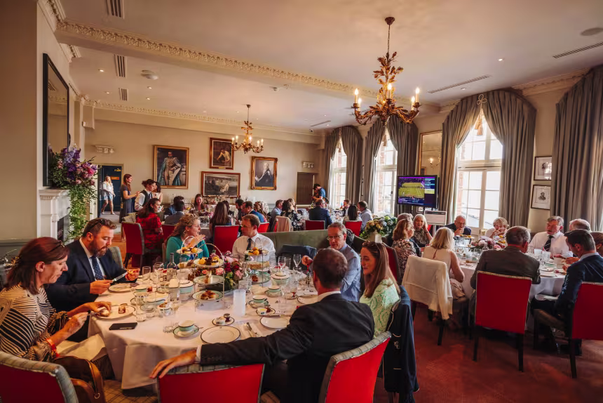 Guests enjoying hospitlaity in The Presidents Room at Queen's Tennis Club