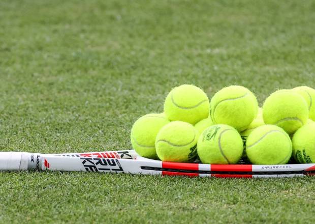 Tennis Balls on racket at All England Lawn Tennis Club