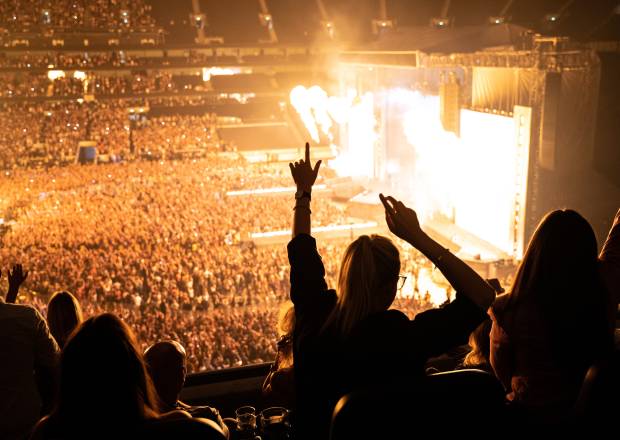 Fans watching concert from premium seats