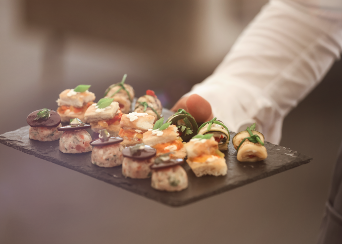 Waiter serving canapes