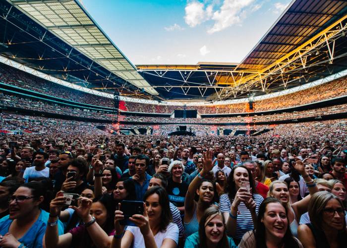 Fans standing at Wembley concert