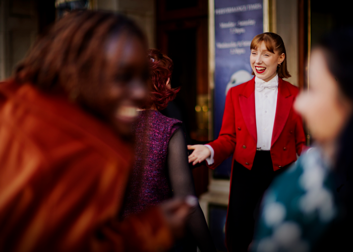 Red Coat Butler greeting guests at The London Palladium