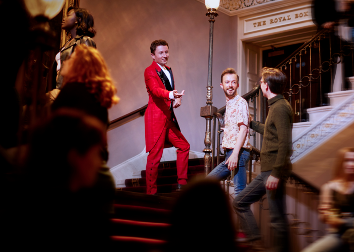 Red Coat Butler greeting guests at The London Palladium