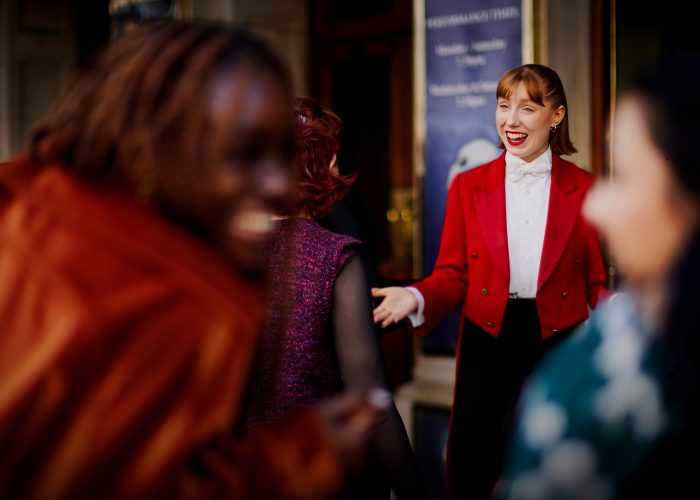 Red coats greet guests