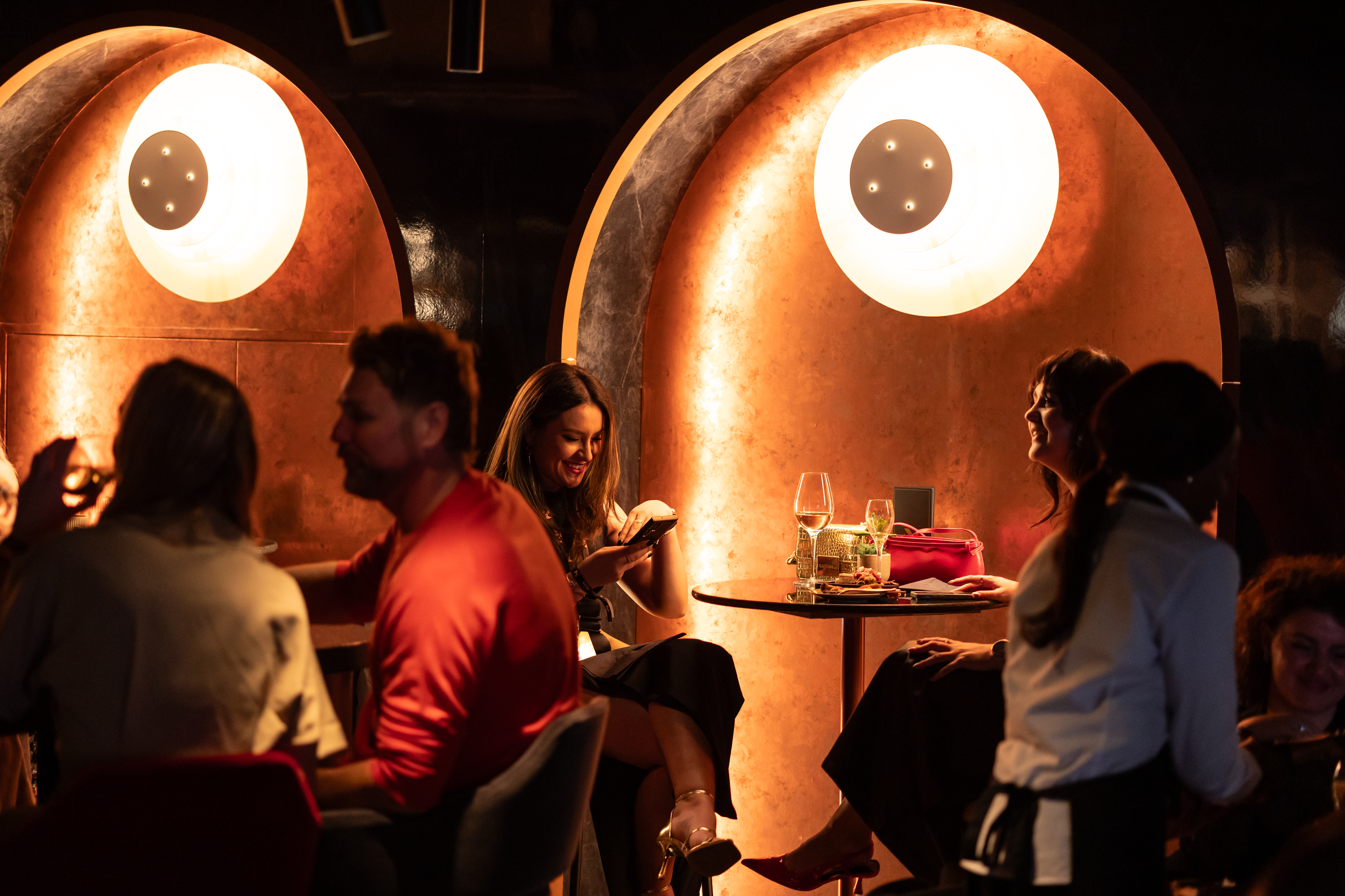 Guests enjoying hospitality at The Mezz Bar at AO Arena