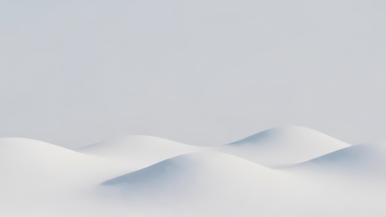 Download this serene abstract winter landscape with rolling snow dunes and subtle shadows.