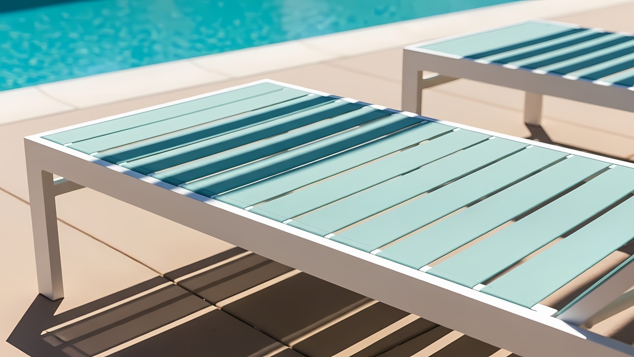 Sunny abstract of modern poolside lounge chairs casting striped shadows by a blue swimming pool. Perfect for summer and relaxation designs.
