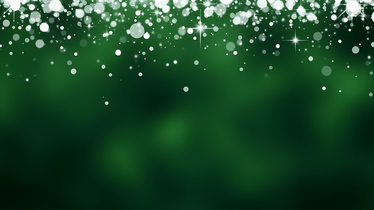 Download this vibrant dark green background with falling white bokeh lights and star sparkles.