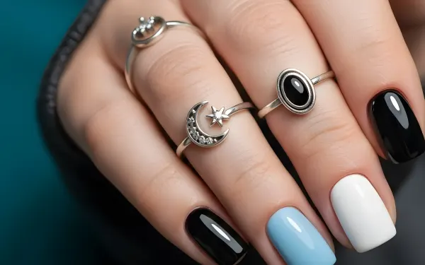 Elevate your designs with this stunning hand showcasing celestial rings and a trendy manicure. Perfect for high-fashion editorials and jewelry advertising campaigns.