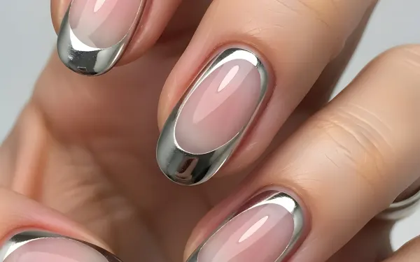 Elevate your designs with this close-up of a chrome-accented French manicure, perfect for beauty blogs or nail salon promotions. Ready for instant commercial use.