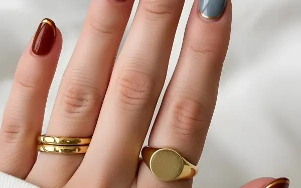 Elevate your designs with this hand showcasing chic nail art and gold jewelry. A premium design asset perfect for high-end branding and beauty projects.
