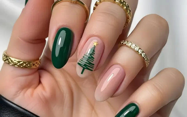 Elevate your holiday designs with this hand featuring festive Christmas tree nail art and elegant gold rings. Perfect for high-end beauty campaigns.