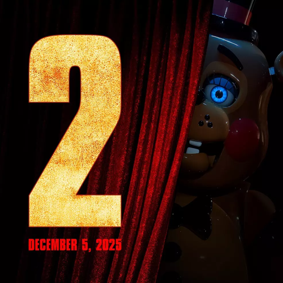 The new poster for FNAF 2, with Toy Freddy peeking from behind a red curtain.
