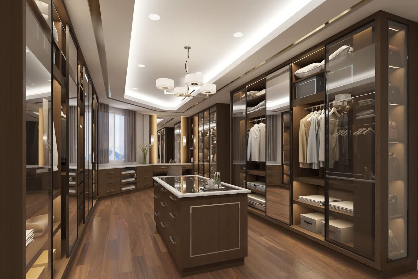 Bespoke wardrobe joinery in Qatar with timber-framed glazed runs and a marble-topped island under a drum pendant