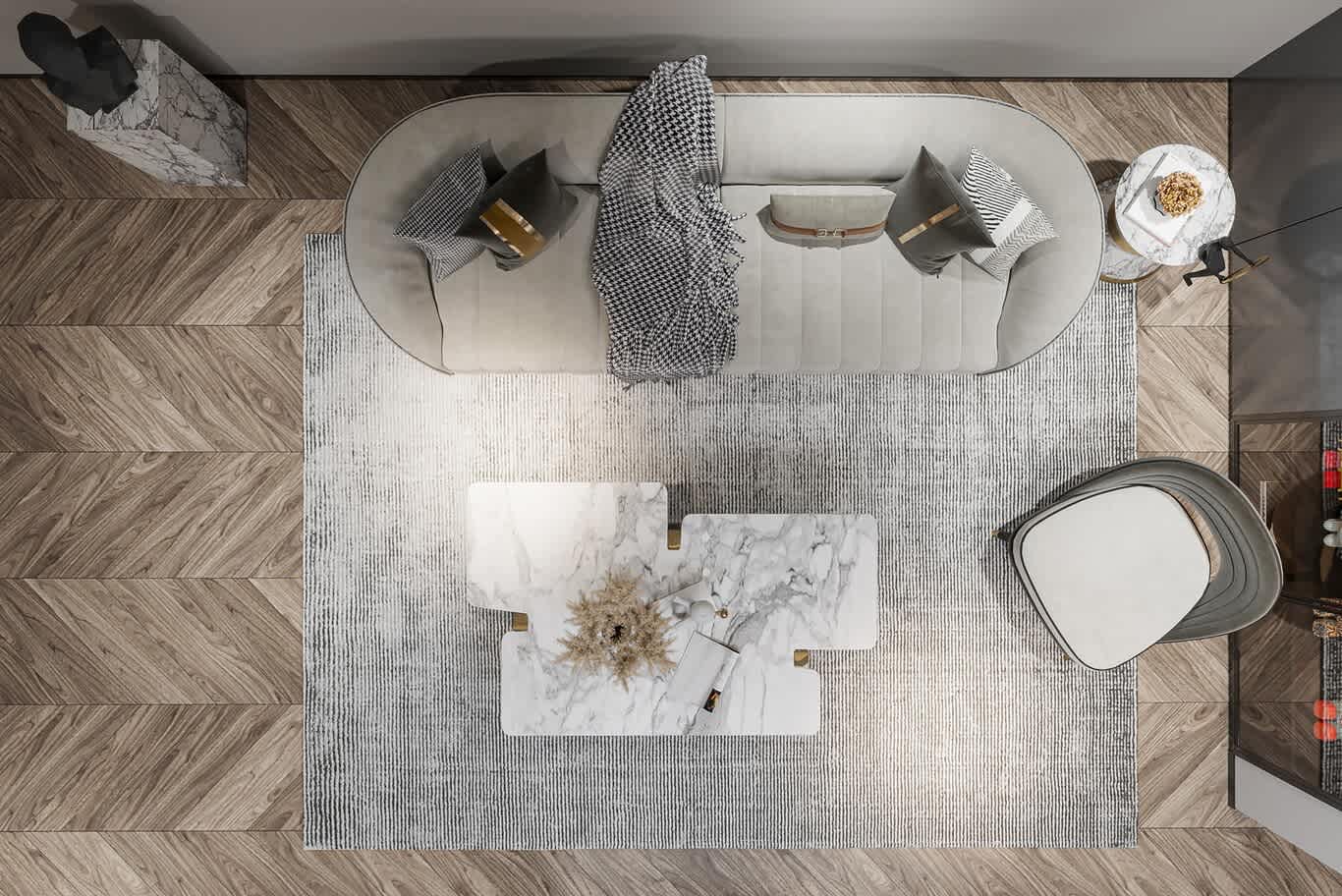 overhead view of curved sofa with leather buckle cushions and marble puzzle coffee table