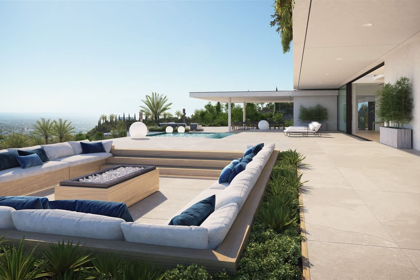 Outdoor living space with sunken lounge, fire table and landscape lighting by the pool