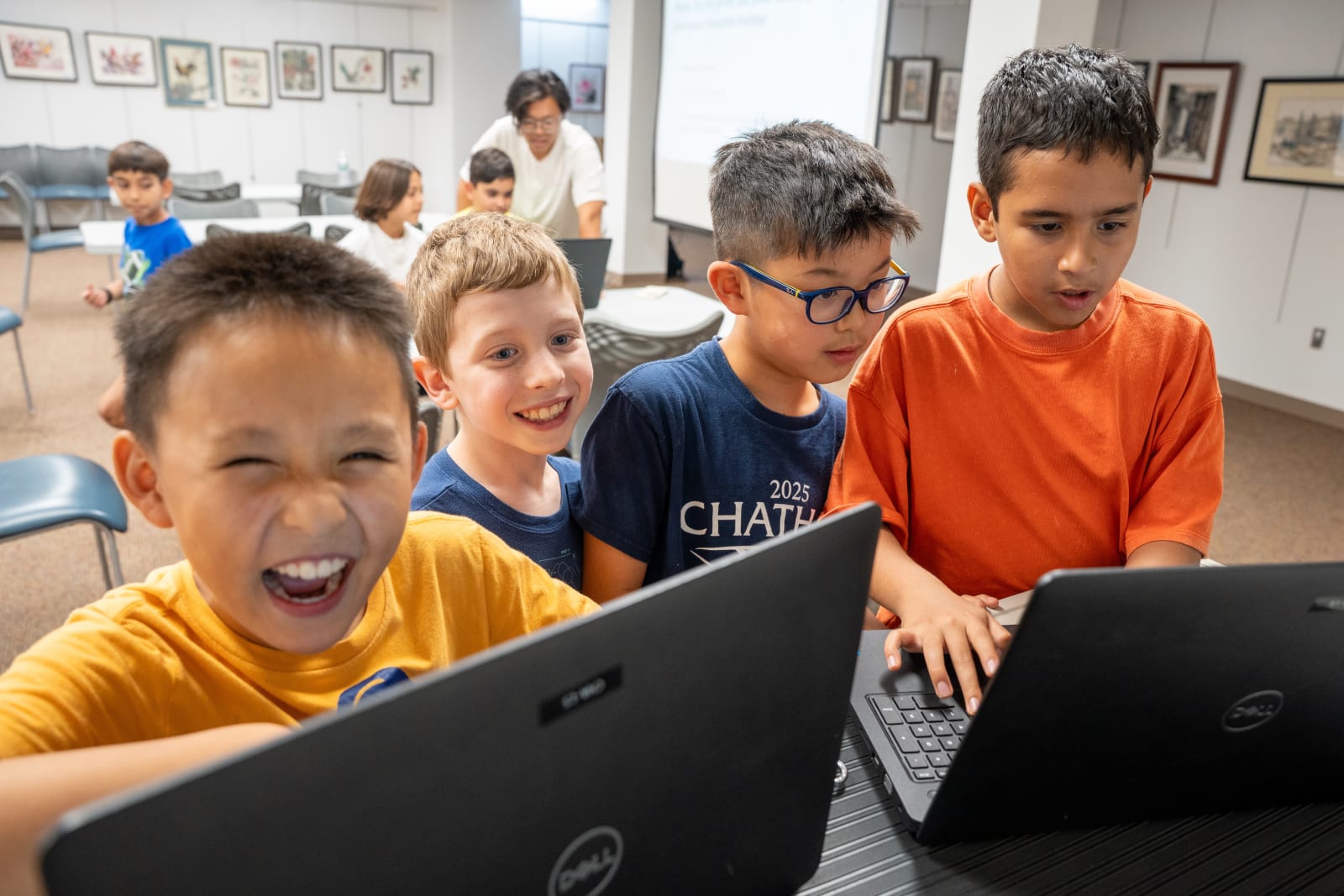 Students practicing Python during a coding workshop
