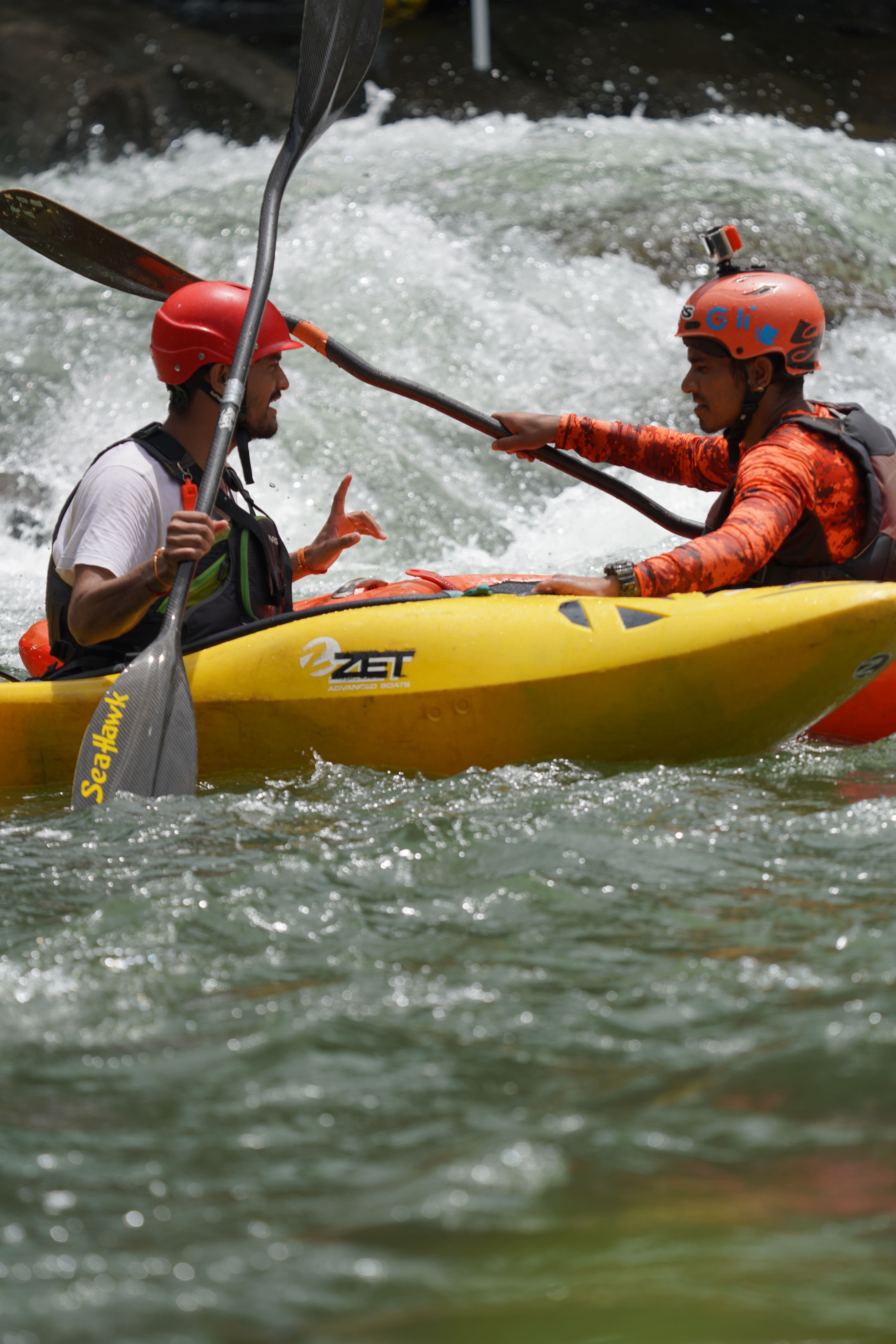 Kayaking instructor demonstrating paddle technique