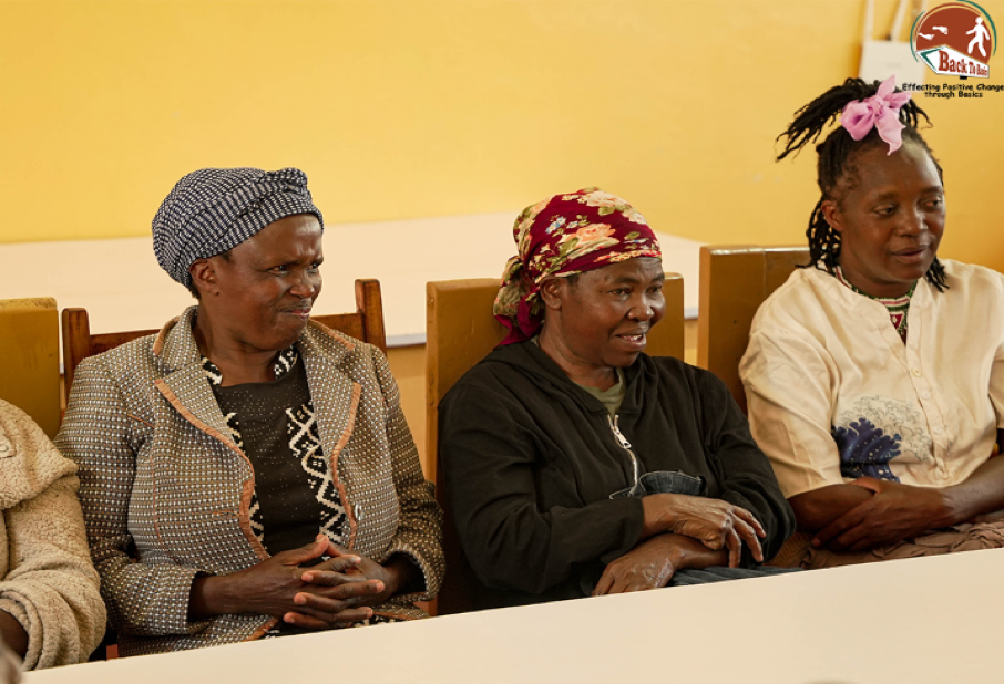 Women eco-ambassadors engaging in discussions on sustainable habits.
