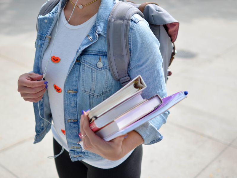 College student holding books