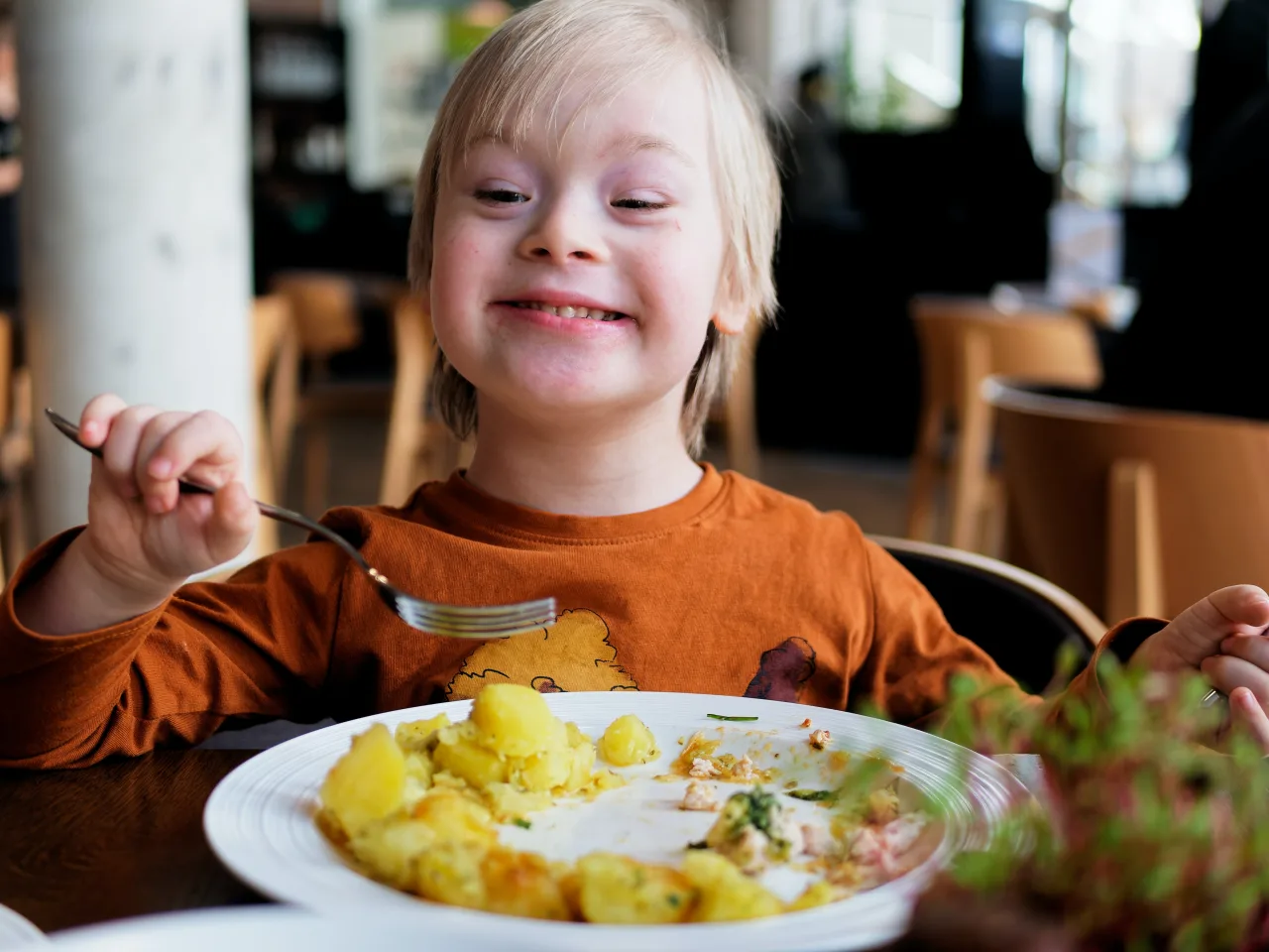 child with special needs eating