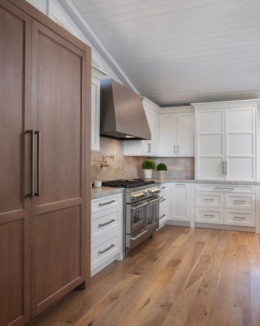 Oak kitchen cabinetry with integrated fridge