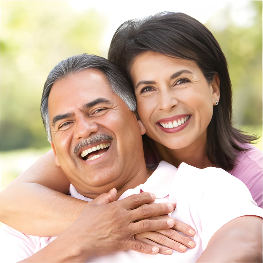 A smiling couple at home, relaxed after sorting out their life insurance together