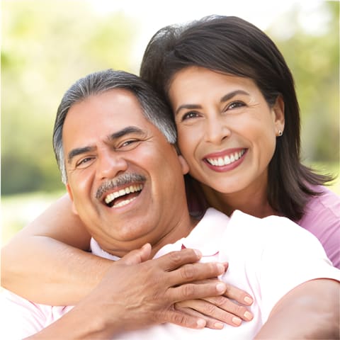 An older couple laughing together
