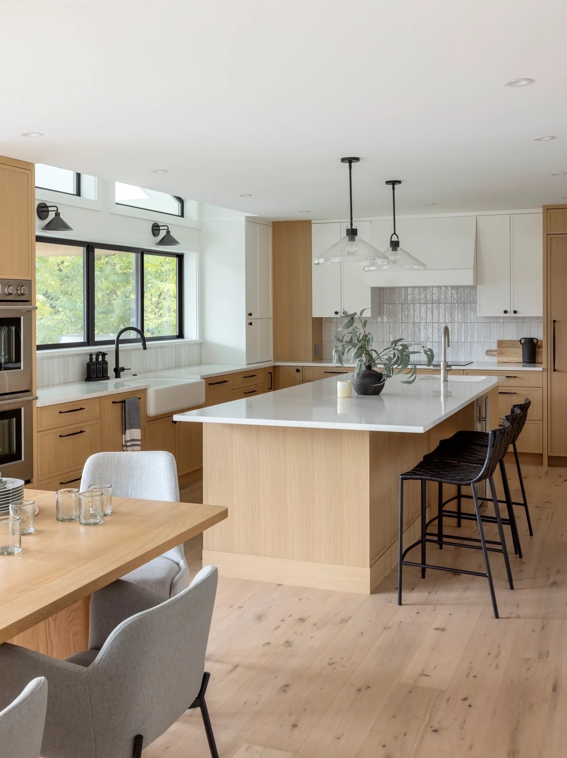 White oak kitchen with island and open dining