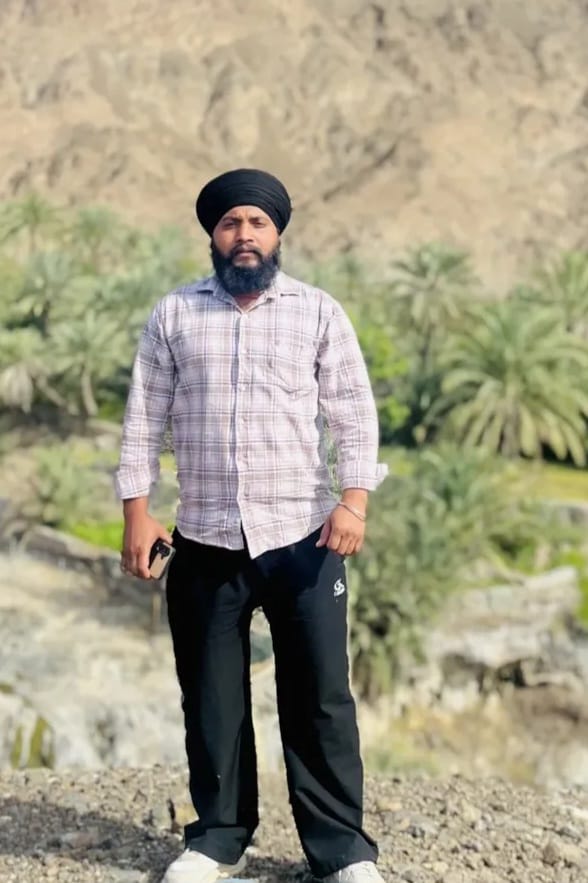 Harpreet Singh holding Pure Ayur Herbs formulation