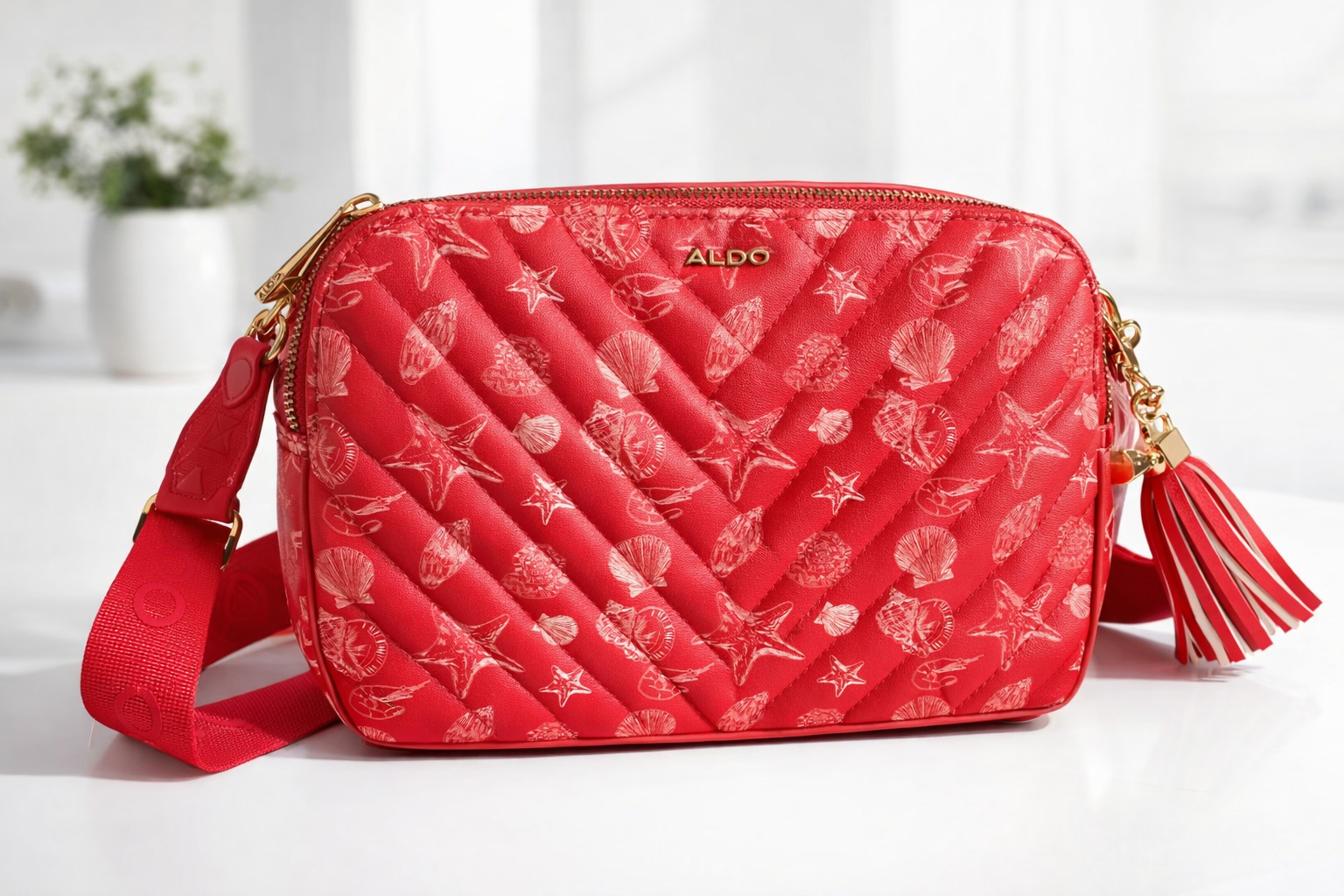 CARTERA ALDO NARANJA CON PATRONES MARINOS