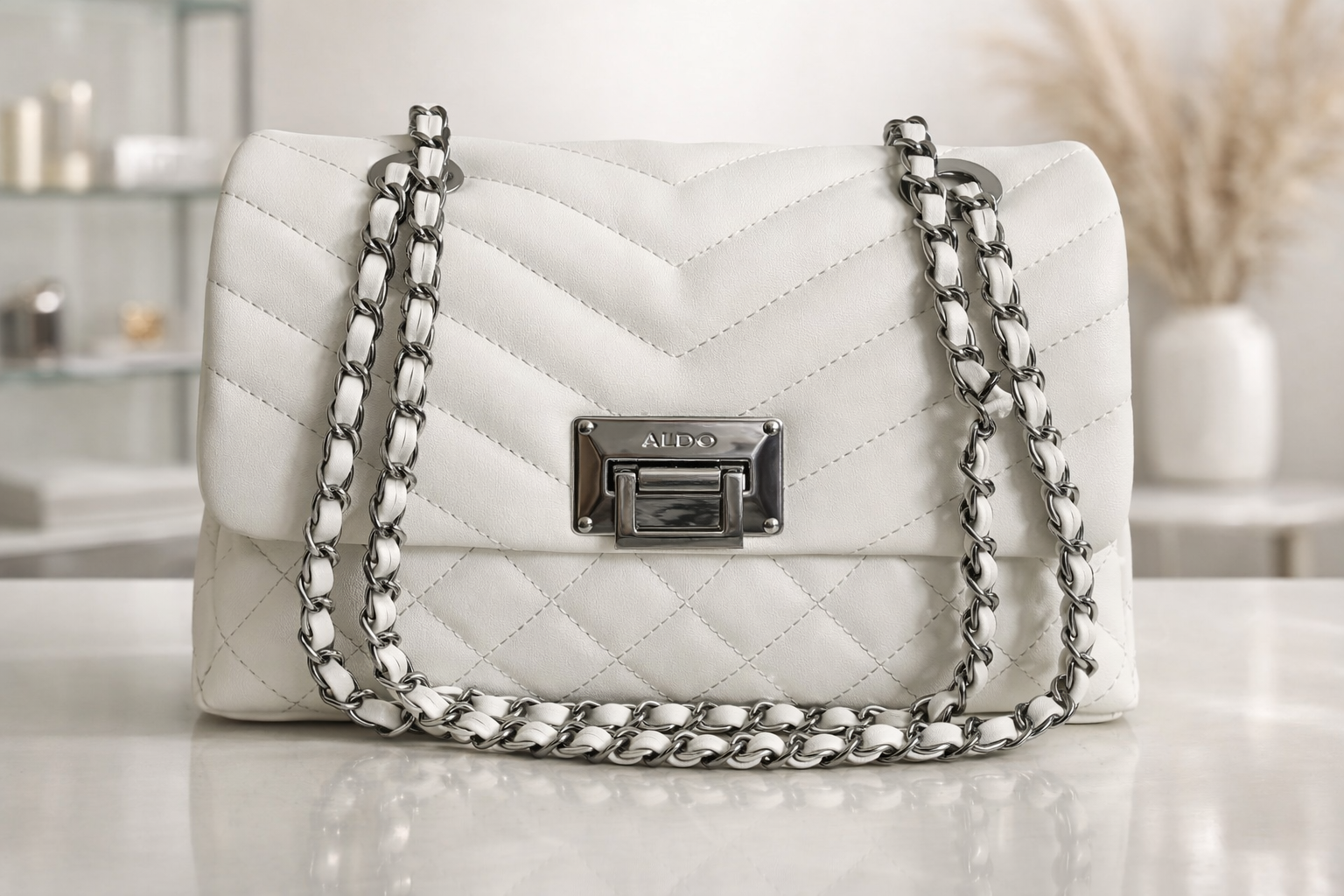 CARTERA ALDO BLANCA HUESO CON CADENAS