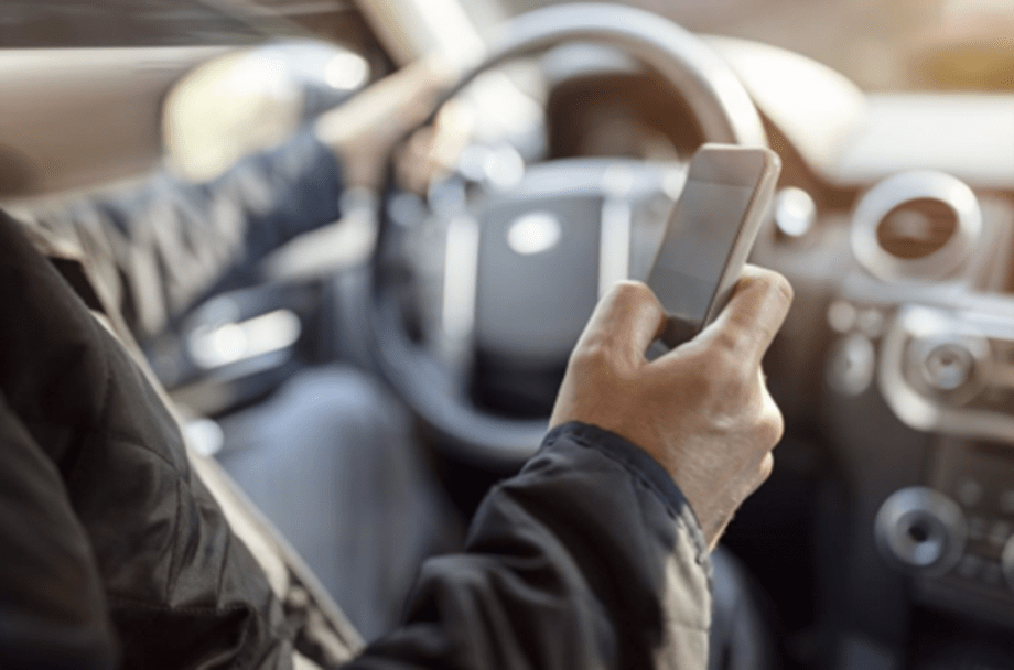 Man using mobile phone while driving